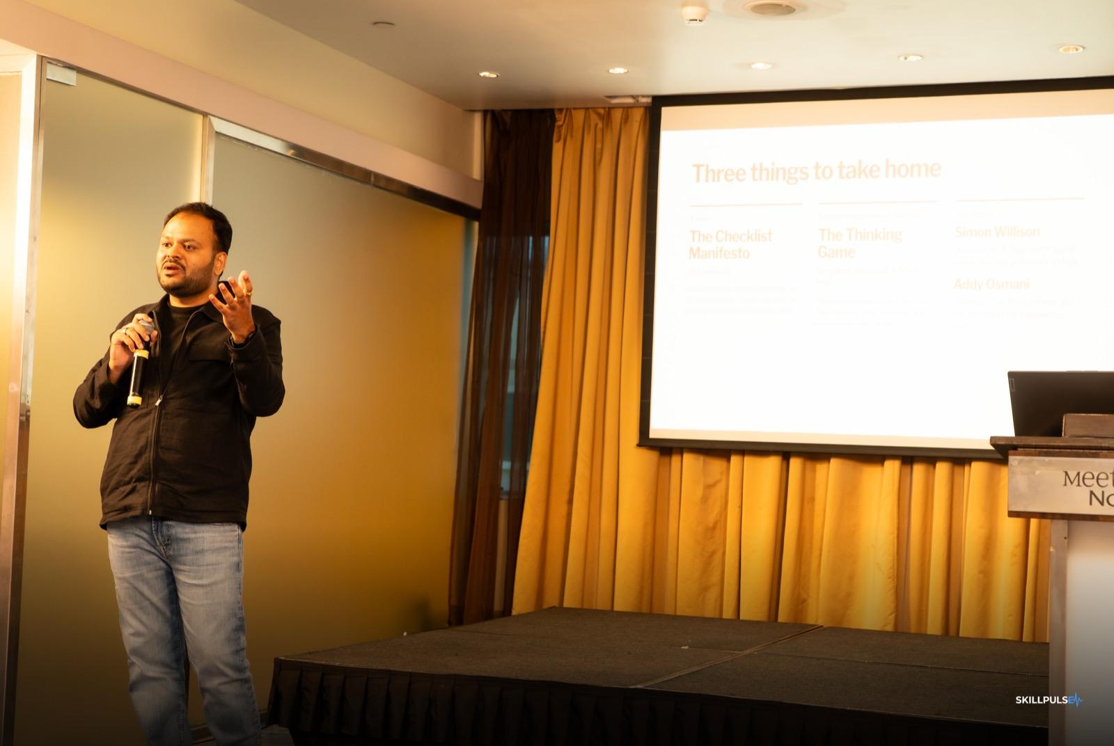 A practitioner presenting to the room at the community meet